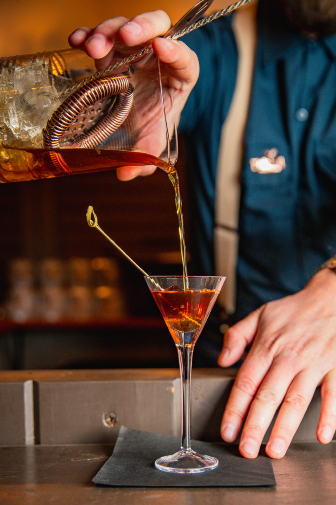 Manhattan cocktail being prepared by Koktail mobile bar bartender